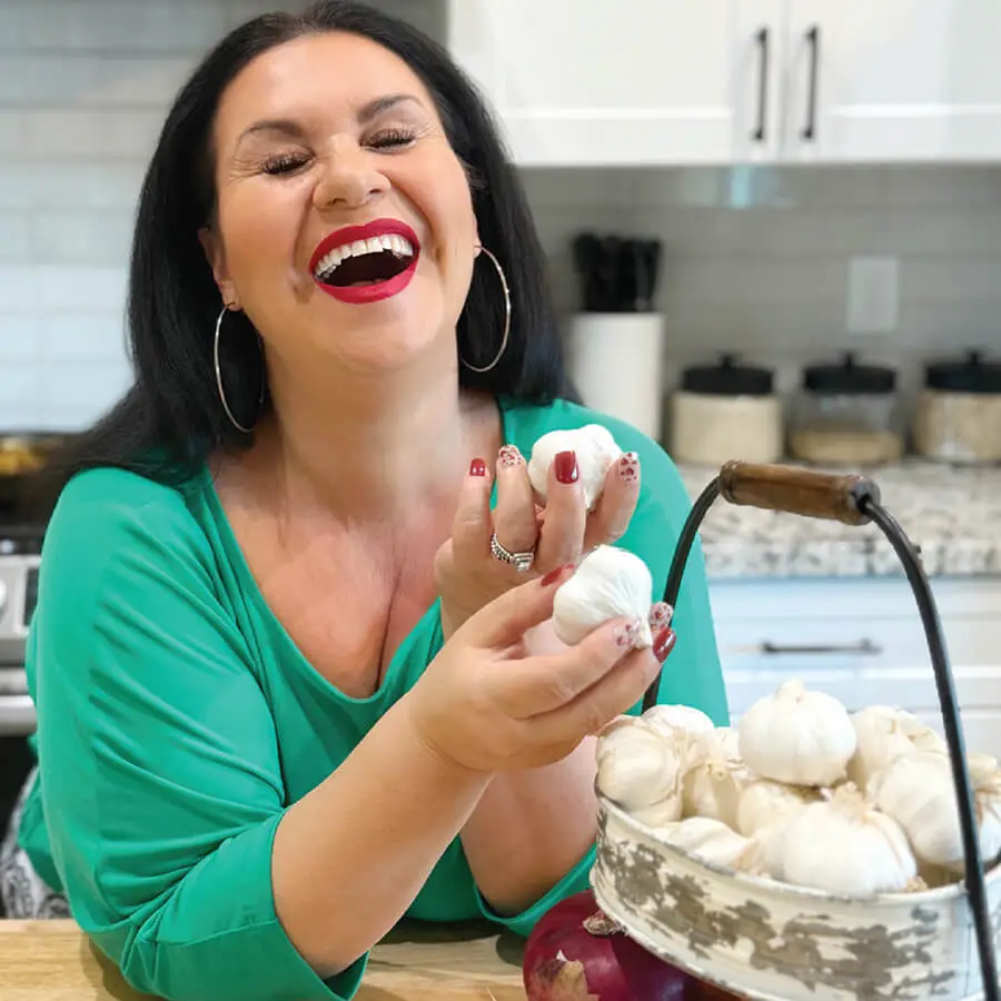 Deanna Holding Garlics and lauging
